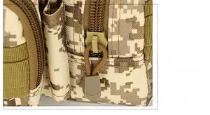 Close-up of tactical waist bag featuring digital desert camo and durable paracord pullers