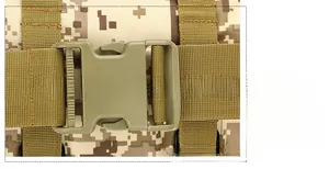 Close-up of military olive green buckle and desert digital camo fabric on tactical bag