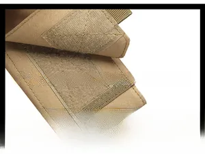 Close-up of tactical bag hook-and-loop closure on durable coyote brown nylon fabric