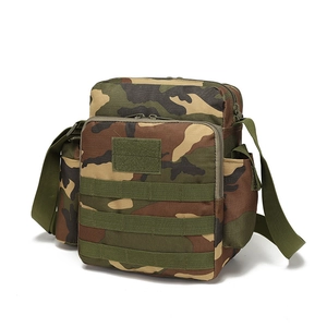 Detail of camouflage tactical sling bag with MOLLE webbing system and adjustable strap