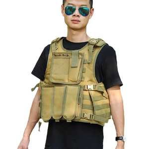 Front view of khaki tactical vest with MOLLE system and magazine pouches on male model