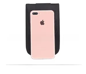 Tactical black nylon phone pouch with buckle showing size comparison with a smartphone
