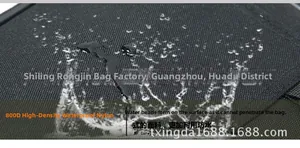 Close-up of 800D high-density waterproof nylon fabric with water droplets on surface