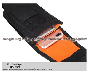 Detail view of black MOLLE tactical pouch showing dual compartments with bright orange lining