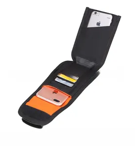 Internal view of tactical MOLLE phone pouch with orange lining and card slots