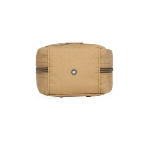 Detailed macro view of khaki tactical waist bag featuring a durable drainage metal eyelet