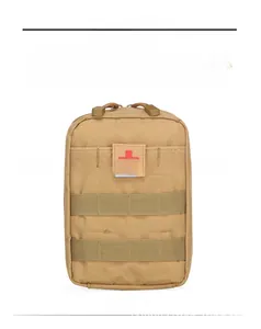 Close-up of khaki tactical medical pouch with red cross patch and Molle system webbing