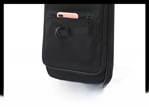 Detailed macro view of the front zipper pocket and D-ring on this black nylon bag