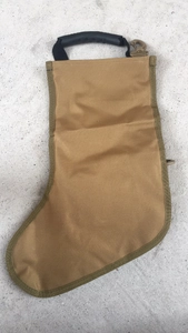 Detailed view of tactical Christmas stocking in coyote brown with rubber carry handle