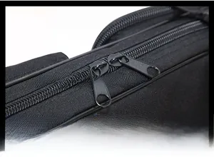 Detailed macro view of the durable double metal zippers on this black 120cm fishing bag