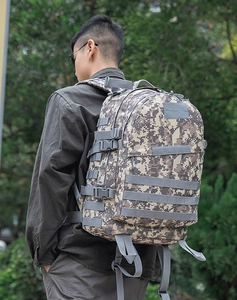 Tactical camouflage backpack with MOLLE webbing for outdoor hiking and military activities