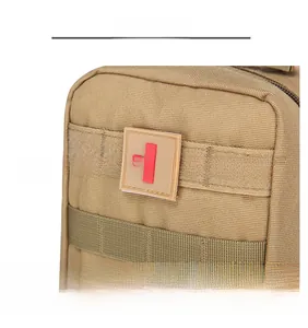 Tactical medical pouch in khaki nylon with velcro area and red cross badge detail