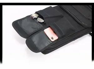 Detail view of durable nylon bag with dual velcro pockets for phone and sunglasses