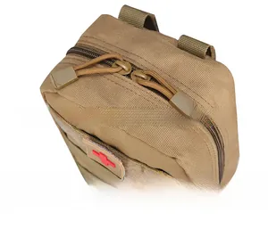 Close-up of tactical medical pouch with red cross patch and durable dual metal zippers