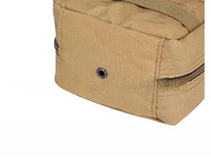 Macro detail of khaki tactical pouch base featuring durable nylon and drainage eyelet