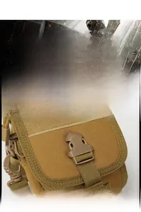 Close-up of durable plastic buckle and coyote brown tactical fabric on the MOLLE pouch