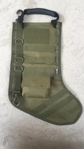 Detailed close-up of army green tactical Christmas stocking with Molle webbing and D-rings