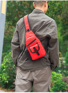 Outdoor red canvas chest bag featuring adjustable straps and water bottle holder on the side