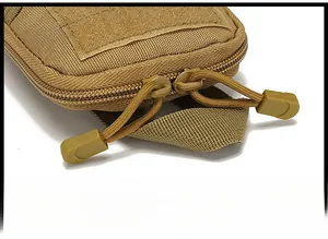 Close-up of durable tactical pouch featuring heavy-duty dual zippers with paracord pullers