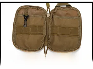 Detail view of khaki tactical waist bag featuring internal compartments and elastic straps