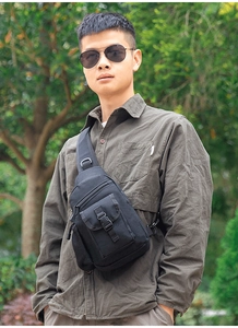 Close-up of tactical chest bag with heavy-duty buckle and durable mesh side pocket