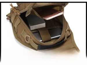 Internal view of tactical chest bag showing zipper pocket and elastic straps for gear