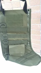 Close-up of military green tactical Christmas stocking with Molle system and D-rings