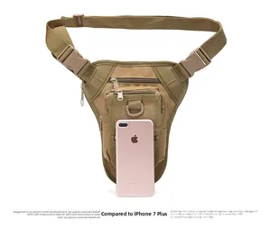 Tactical leg bag in khaki nylon showing multiple zip compartments next to an iPhone for size