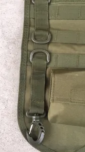 Detailed view of military green tactical nylon bag with MOLLE webbing and D-ring