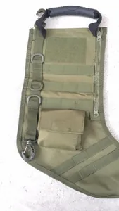 Close-up of olive green tactical stocking bag featuring MOLLE webbing and D-ring loops