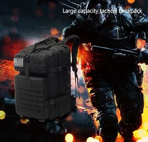 Tactical black backpack with MOLLE system and American flag patch in a rugged scene
