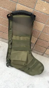 Detailed view of olive tactical Christmas stocking with MOLLE webbing and side pouch