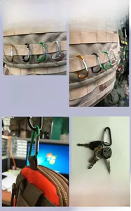 Detail view of multi-color aluminum D-ring carabiners attached to tactical gear and keys