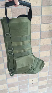 Detail of olive green tactical Christmas stocking featuring MOLLE webbing and D-rings