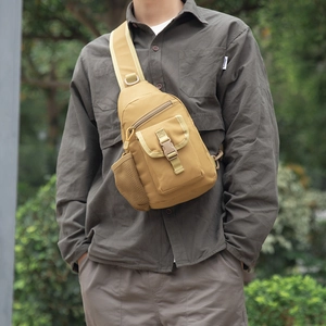 Detail view of khaki tactical chest bag with durable buckle and side mesh pocket