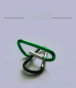 Detail view of green and black D-shaped aluminum alloy carabiners for outdoor gear