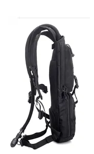 Side view of black tactical backpack with hydration hose port and adjustable buckles