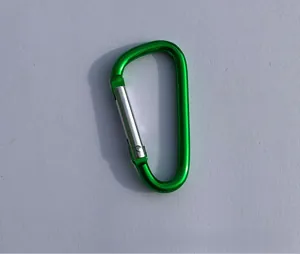 Macro view of green D-shape aluminum alloy carabiner with silver spring gate clip