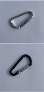 Close-up of D-shaped aluminum alloy carabiners in silver and black colors