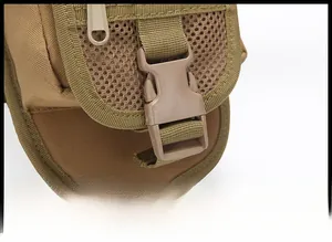 Close-up of secure plastic buckle and nylon webbing on a tactical camo waist bag