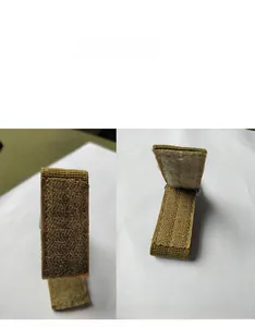 Close-up of khaki tactical MOLLE nylon webbing strap with hook-and-loop closure