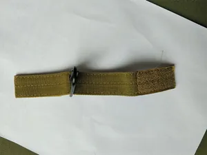 Detail of army green nylon MOLLE strap with D-ring and Velcro fastener for backpack