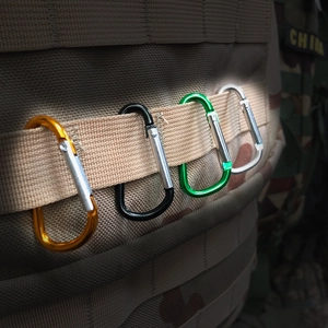 Aluminum D-ring carabiner clips in multiple colors attached to a tactical backpack