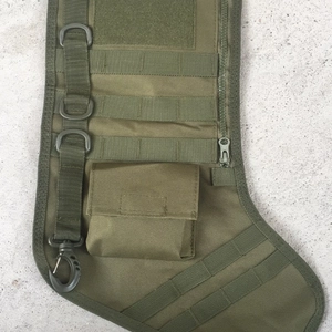 Tactical Christmas stocking made of durable olive drab nylon with MOLLE system and metal hooks