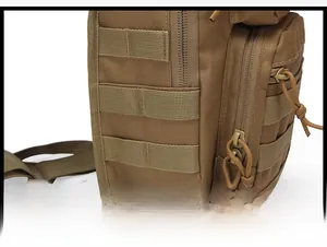 Detail of a coyote tan tactical bag showing reinforced Molle webbing and durable nylon texture