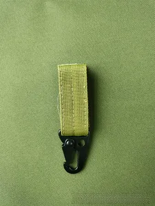 Detail of high-density nylon webbing with black metal eagle claw hook for outdoor gear