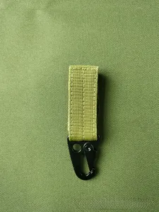 Detail of army green nylon MOLLE webbing with black D-ring buckle for tactical backpacks