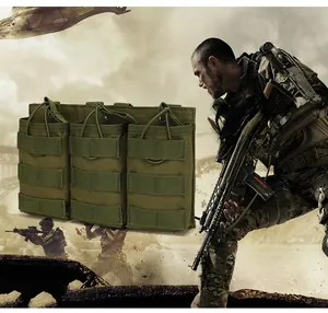 Detail view of military green triple magazine pouch with elastic cord and Molle webbing
