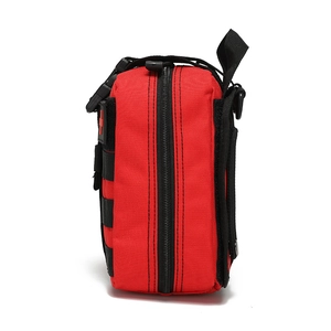 Detail view of the red tactical first aid kit showing MOLLE webbing and durable zipper