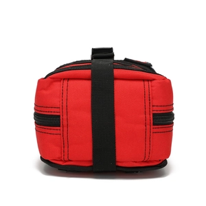 Detailed view of a red tactical medical pouch made of durable nylon with black straps